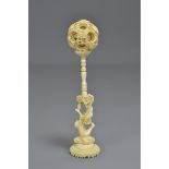 A Chinese 19th century ivory puzzle ball on a carved ivory stand. 16cm (H)