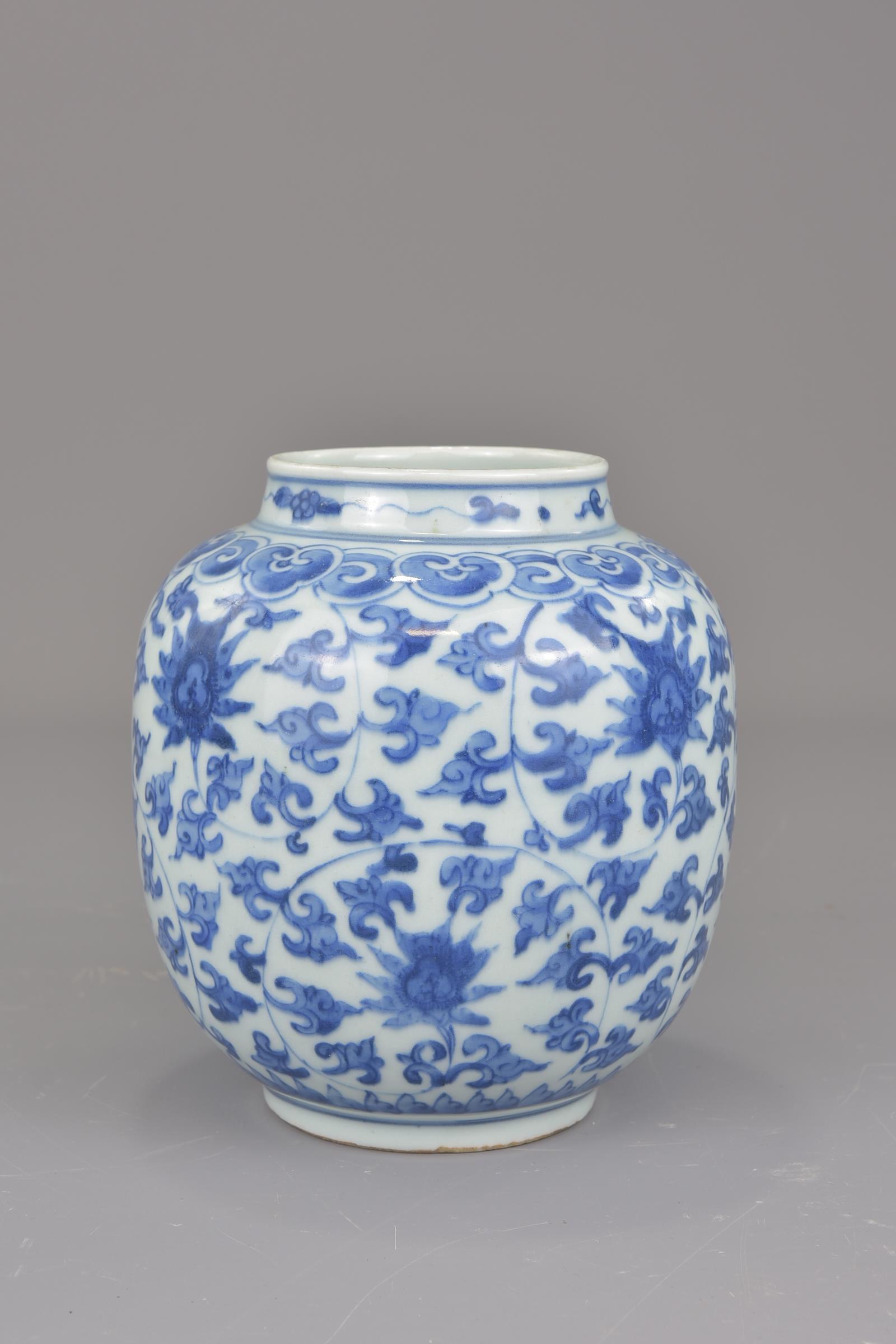 A Chinese blue and white porcelain jar possibly Ming painted with a floral design. 16cm tall - Image 3 of 7