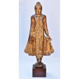 A very tall 19/20th century gilt wooden standing Thai Buddha on wooden stand. 173cm tall with stand