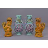 A pair of 19th century turquoise glazed porcelain vases with dragon handles bearing a six character