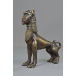 A heavy 19th century Egyptian bronze figure of human head on lion's body sphinx. 18cm x 20cm