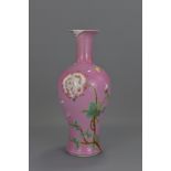 A Chinese 18th century ruby-pink enamelled porcelain vase decorated with flowers and butterflies. Un