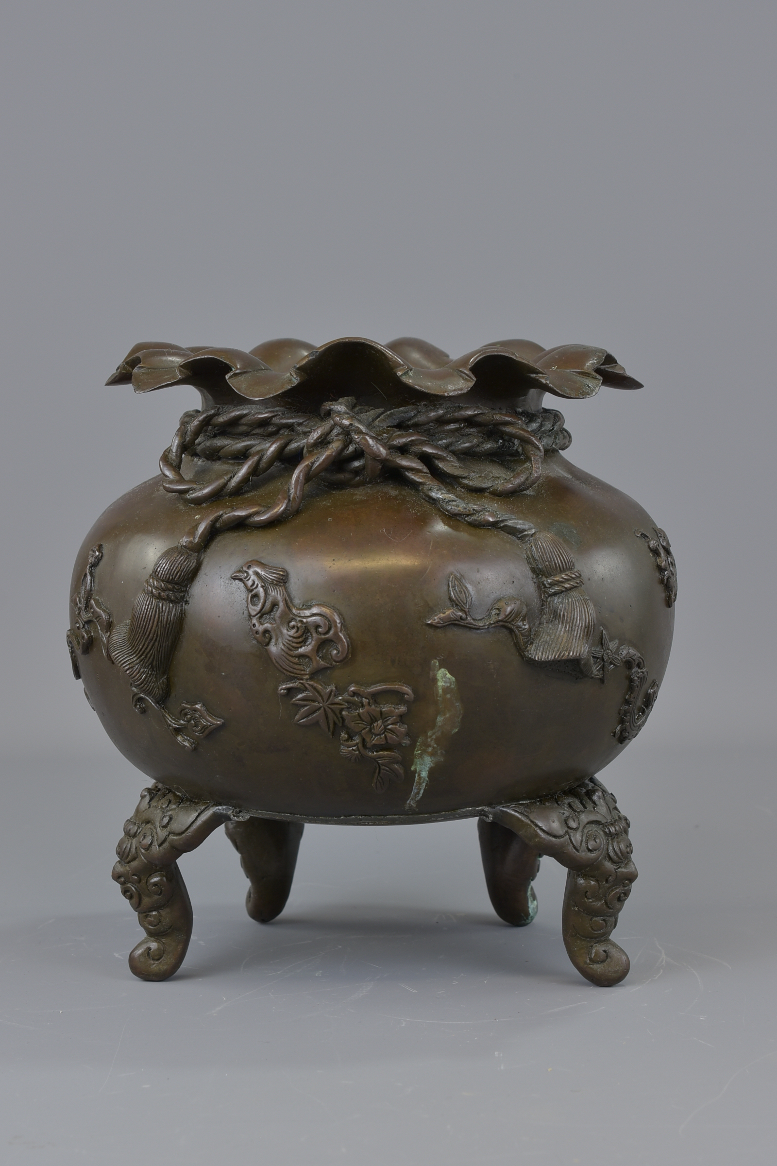 A Japanese 19th century Meiji period bronze censer. One leg missing. Makers mark to base. 23cm wide