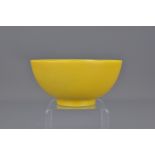 A Chinese 18th century yellow Peking glass bowl incised with four character mark of Qinglong and of