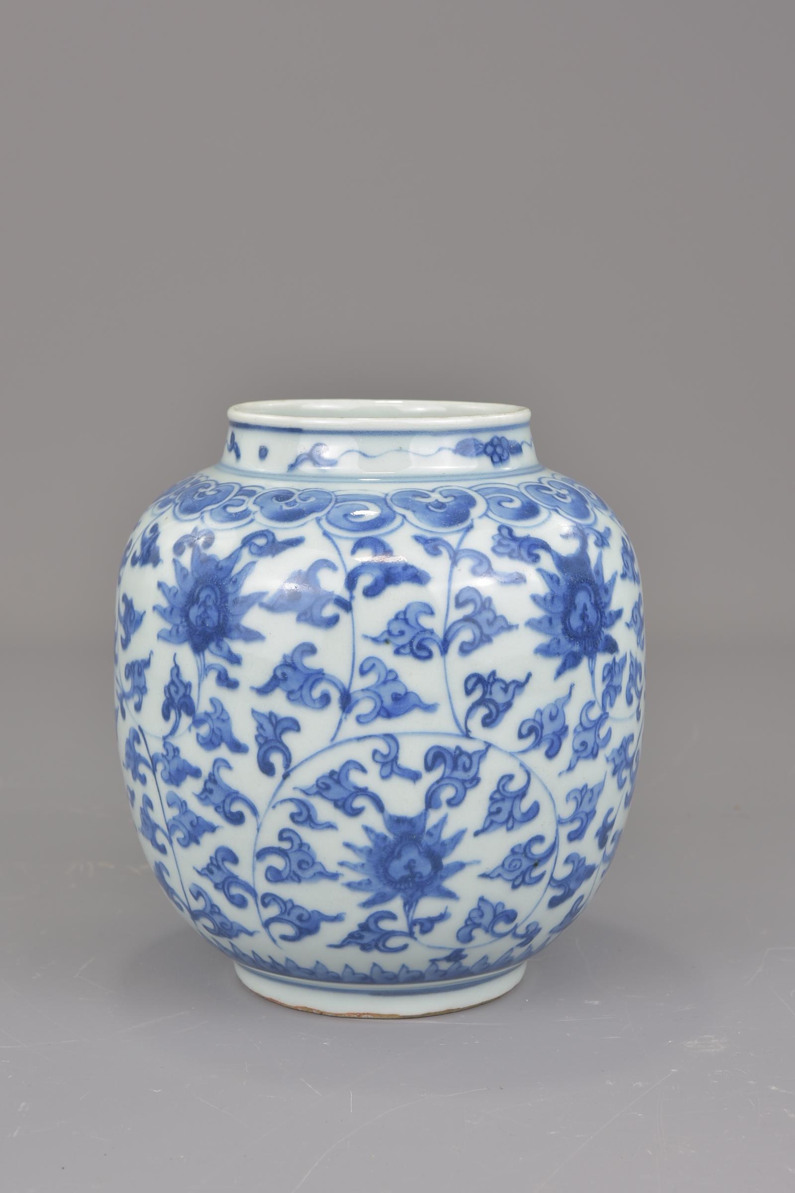 A Chinese blue and white porcelain jar possibly Ming painted with a floral design. 16cm tall - Image 2 of 7