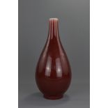 A large Chinese 19th century copper red Sang De Boeuf pear shaped porcelain vase. Incised six charac