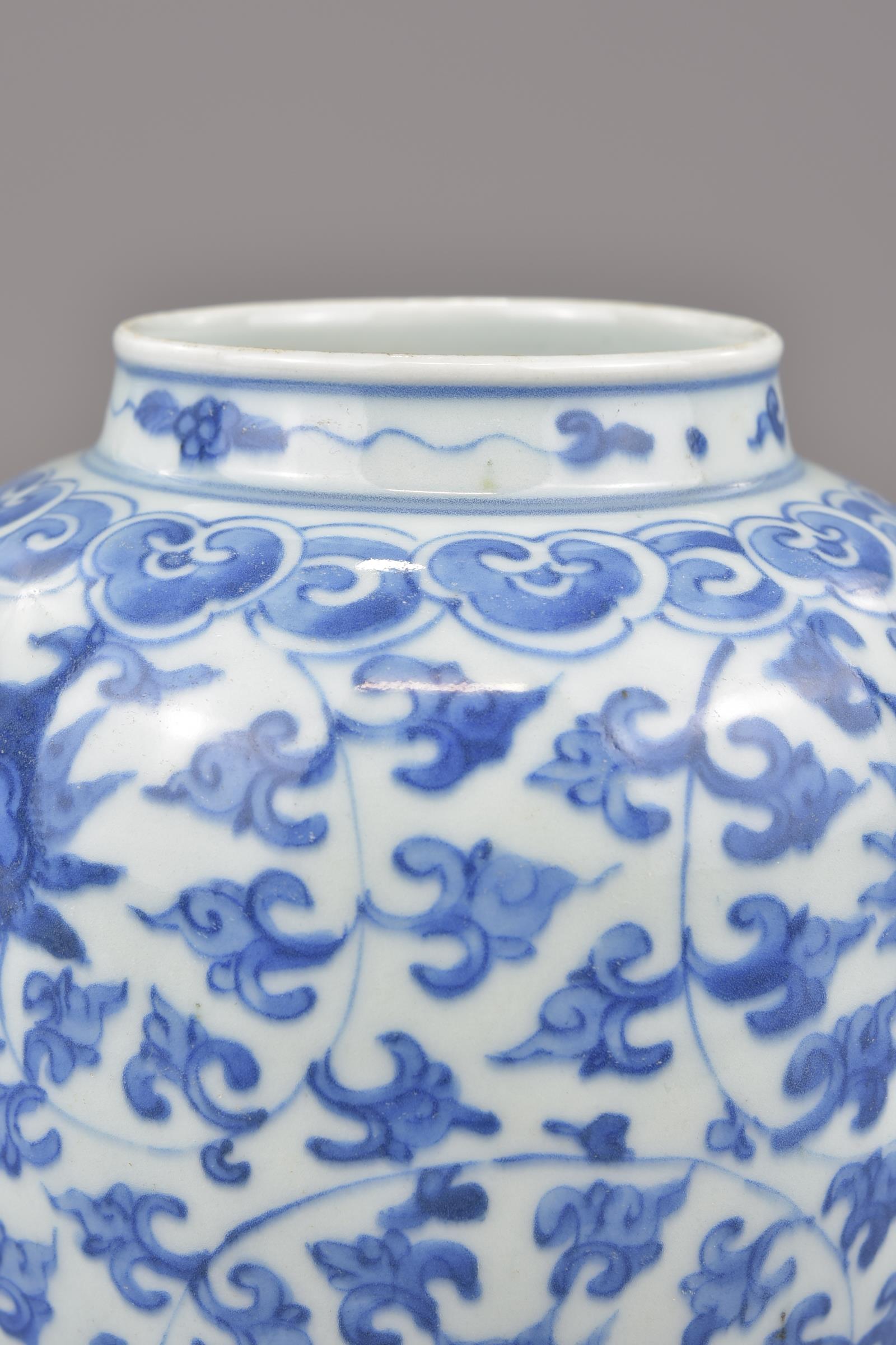 A Chinese blue and white porcelain jar possibly Ming painted with a floral design. 16cm tall - Image 4 of 7