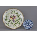 A large Japanese 19th century famille rose porcelain dish together with a smaller 18th century blue