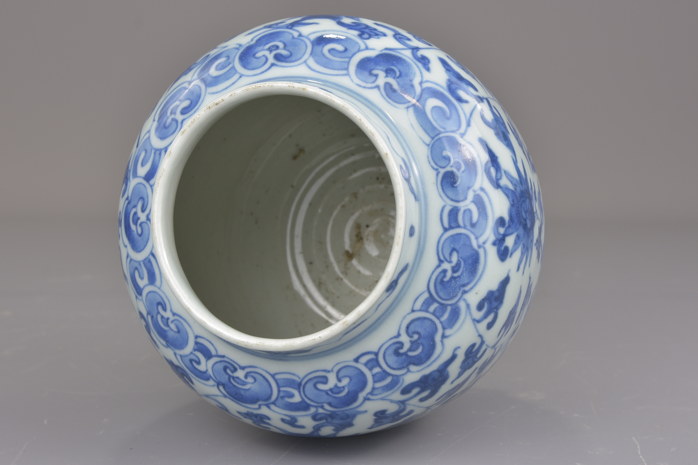 A Chinese blue and white porcelain jar possibly Ming painted with a floral design. 16cm tall - Image 7 of 7