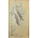 A Chinese 20th century watercolour on paper in scroll of two carp with inscriptions. Signed with thr