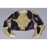 An Ottoman late 19th century embroidered jacket with woven gold thread decoration. 145cm across x 37