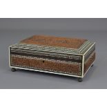 An Indian 19th century sandalwood box inlaid with bone and ebony. 22 cm length.