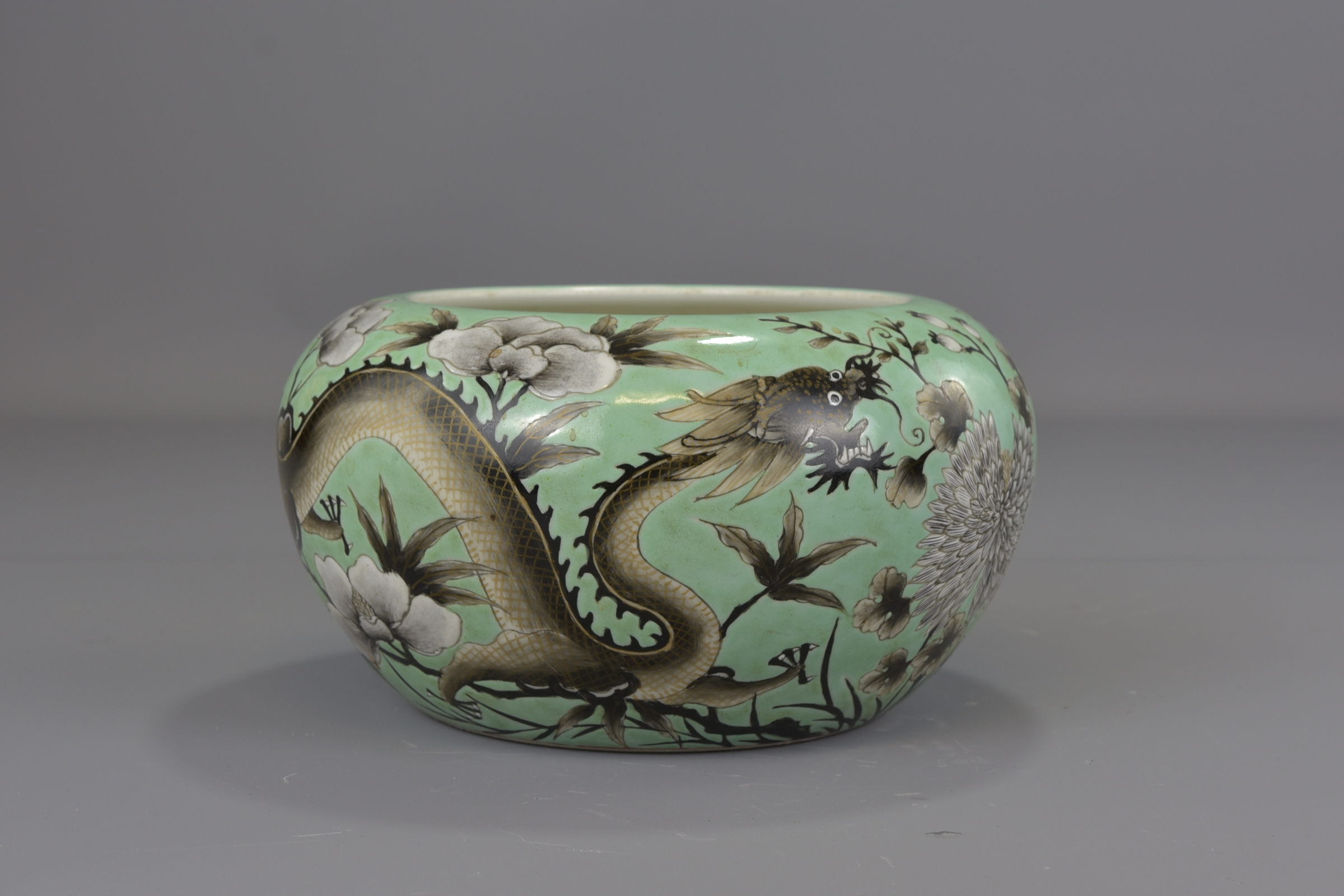 A Chinese 19th century turquoise green glazed porcelain brush washer with six character mark GuangXu