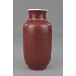 A Chinese 19th century red glazed porcelain vase. 16cm height