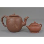 Two Chinese 20th century Yixing teapots. 14cm - 19cm (2)