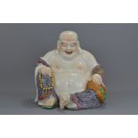 A Chinese 20th century Famille rose porcelain Buddha of happiness holding prayer beads with impresse