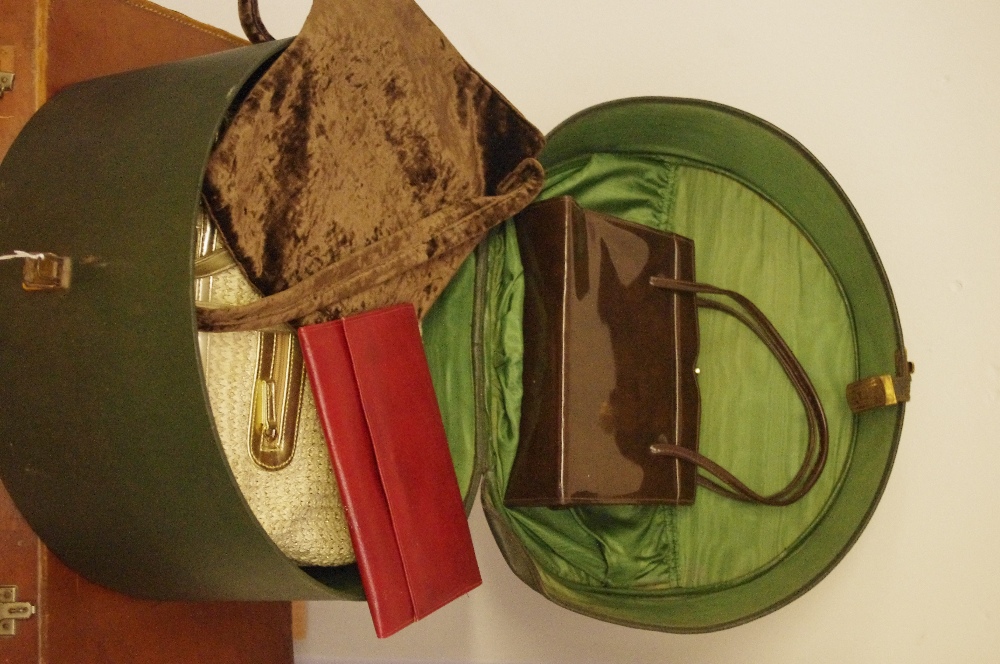 A silk lined lady's hat box, handbags and a case.