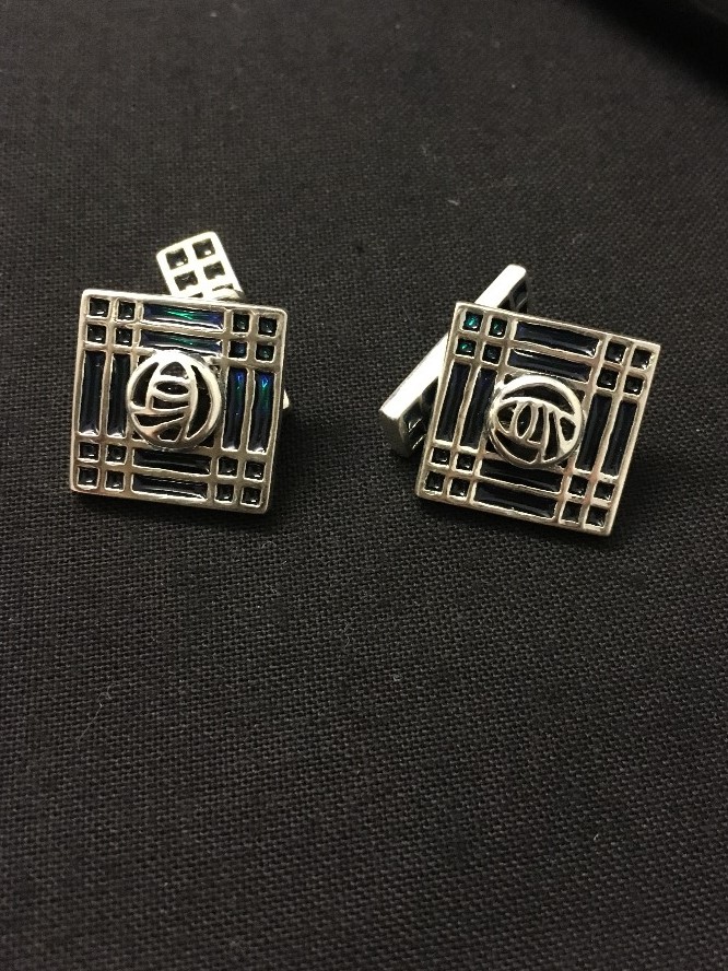 A pair of silver enamel cufflinks.