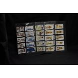 A collection of assorted cigarette cards.