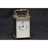 A brass carriage clock.