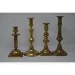 Eight assorted 19th Century brass candle sticks.