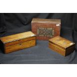 A four drawer Windsor stationery cabinet and three lidded wooden boxes.