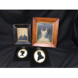 An assortment of miniature framed and glazed portraits.