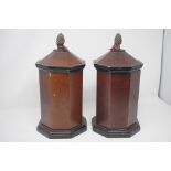 A pair of octagonal shaped lidded containers.