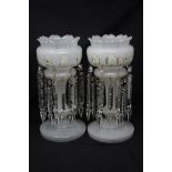 A pair of Victorian white opaline glass mantel lustres with drops.