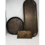 Three hand beaten copper trays.