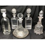 Six assorted glass decanters.