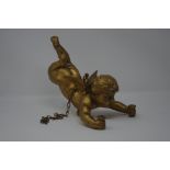 A gilt decorated suspended cherub.