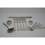 An assortment of silver plate flatware.