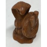 A Japanese fruitwood netsuke.