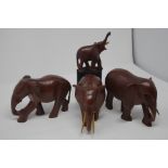 A collection of wooden carved native African animals.