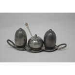 A Liberty style three piece pewter cruet set.