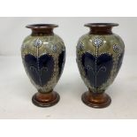 A pair of Royal Doulton glazed vases.