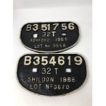 Two cast metal railway plaques.