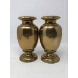 A pair of 19th Century turned brass baluster shaped vases.