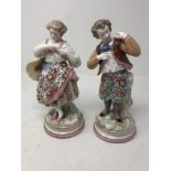 A pair of Continental ceramic figures.