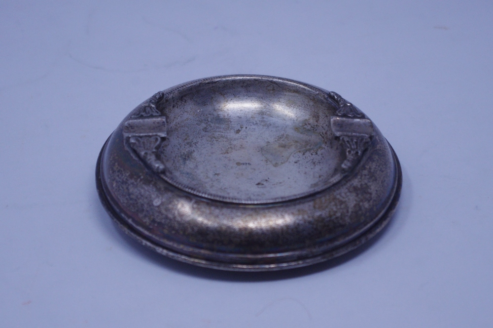 A silver ashtray.