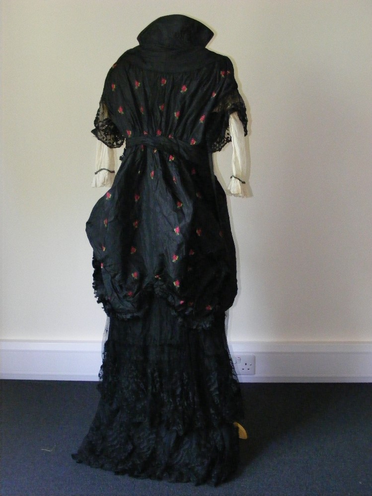 A day/afternoon dress circa 1880, black silk and net with the silk embroidered with flowers. - Image 2 of 3