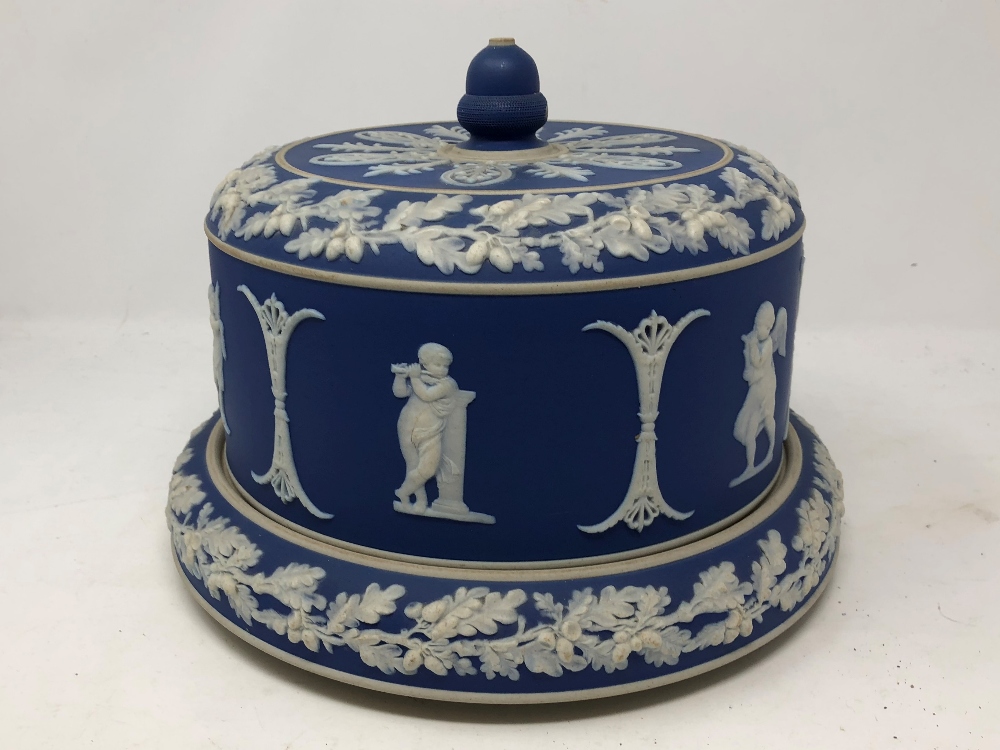 A blue jasperware cheese dish and cover (possibly Wedgwood).