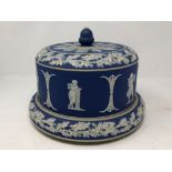 A blue jasperware cheese dish and cover (possibly Wedgwood).