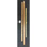 Three assorted wooden and brass capped measuring sticks.