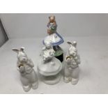 A collection of Alice in Wonderland ceramic figures.