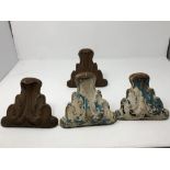 A set of four cast iron bath feet, a brass table top and a brass jardiniere.