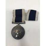A boxed Royal Navy Long Service medal.