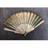 A folding fan circa 1850 with mother of pearl monture.