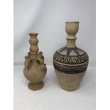 Three terracotta earthenware vases.